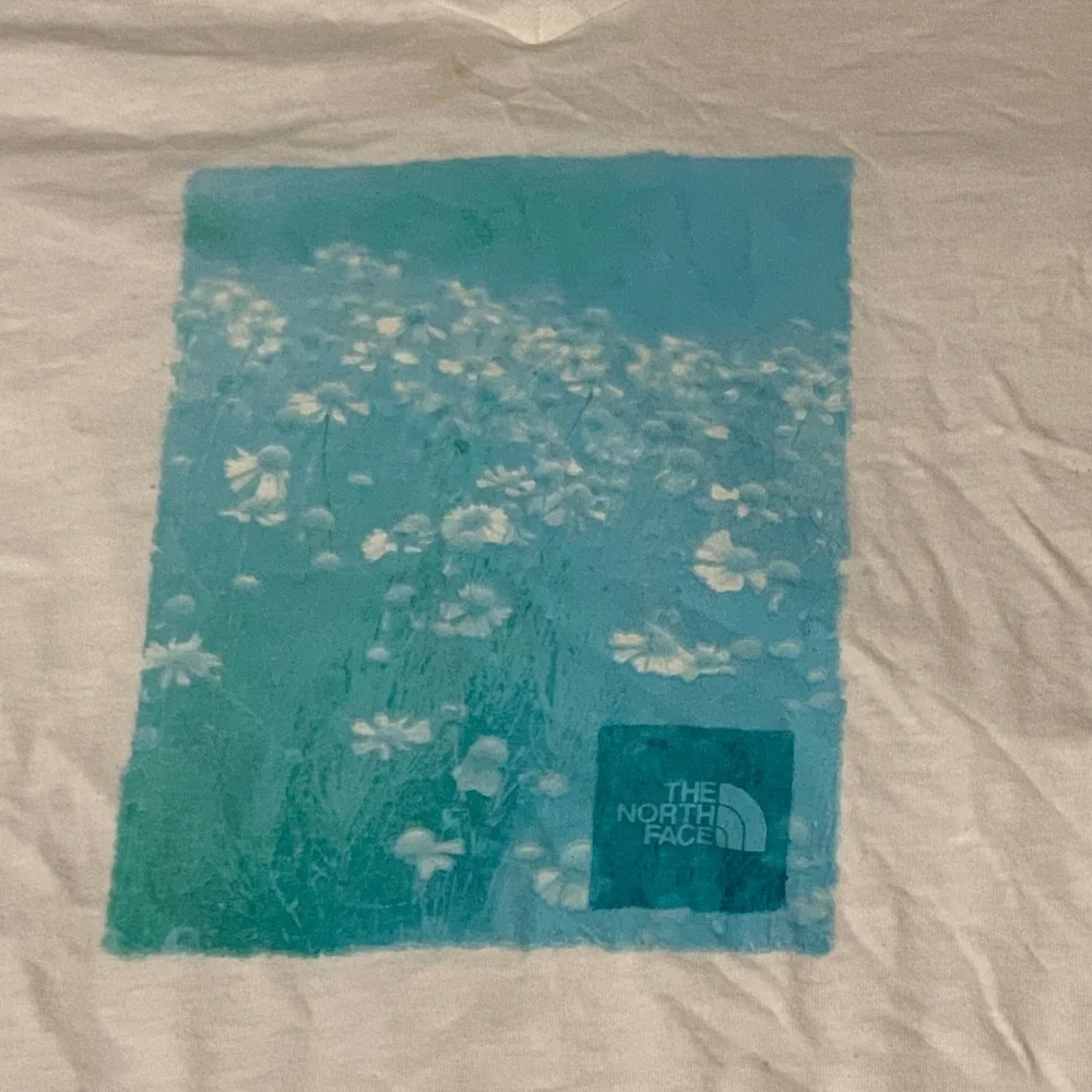 The North Face Women’s White V-Neck Tee with Aqua Graphic - Picture 2 of 10